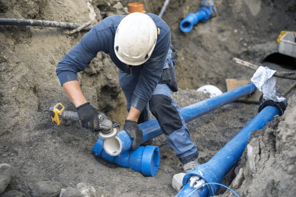 plumber repairing a sewer line in Wisconsin
